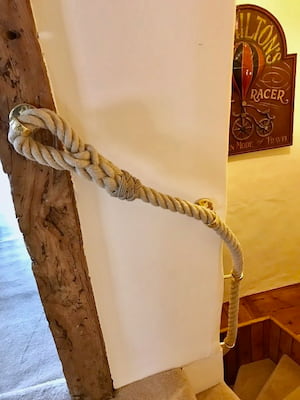 Eye splice with Turks Head whipping on narrow staircase Eye splice with Turks Head whipping on narrow staircase