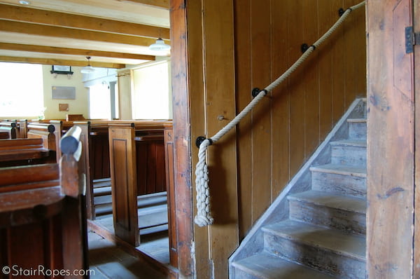 Hemp rope handrails with hammered finish iron fittings and crown plait endings