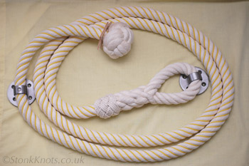 Stair rope in cotton wormed with yellow polypropylene cord, manrope knot and eyesplice with turks head whipping