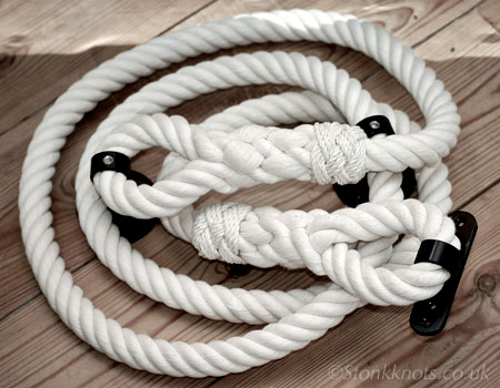 stair rope in cotton with spliced ends, turks head whippings, and custom made wrought iron fittings